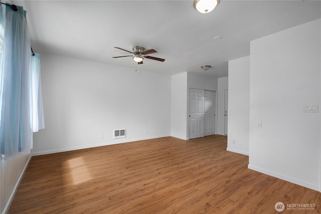 2116 Union Ave SE, Olympia, WA 98501 - unfurnished room with ceiling fan, wood finished floors, and baseboards