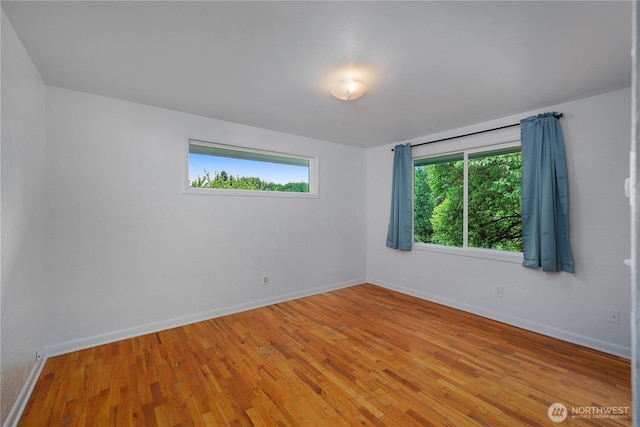 2116 Union Ave SE, Olympia, WA 98501 - spare room with baseboards and light wood-style flooring