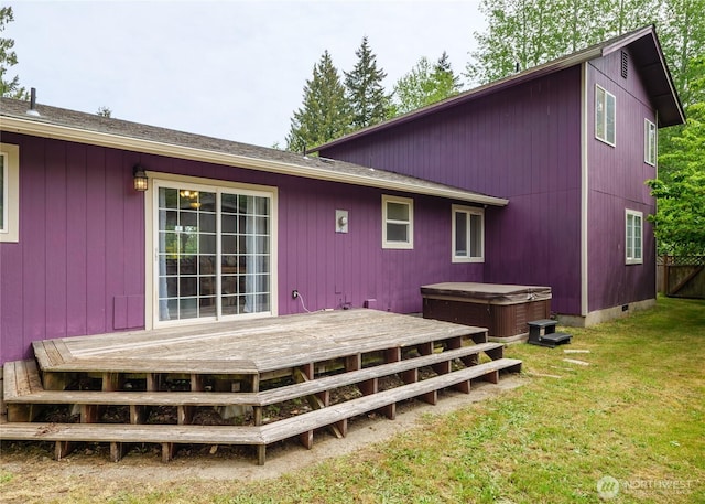 1138 W 17th, Port Angeles, WA 98363 - back of property featuring a hot tub, a wooden deck, and a lawn