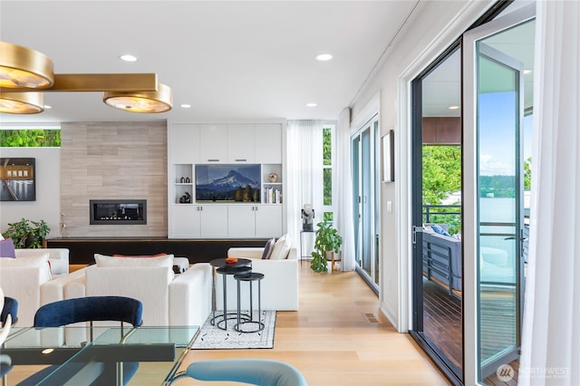 7734 Seward Park Ave S, Seattle, WA 98118 - living room featuring light wood-type flooring, recessed lighting, and a fireplace