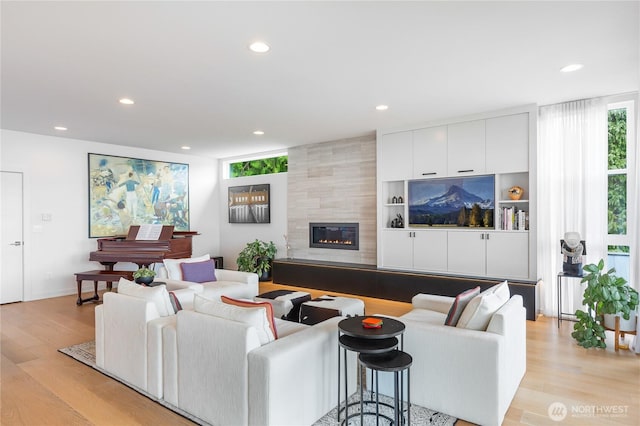 7734 Seward Park Ave S, Seattle, WA 98118 - living room featuring recessed lighting, light wood-style flooring, and a fireplace