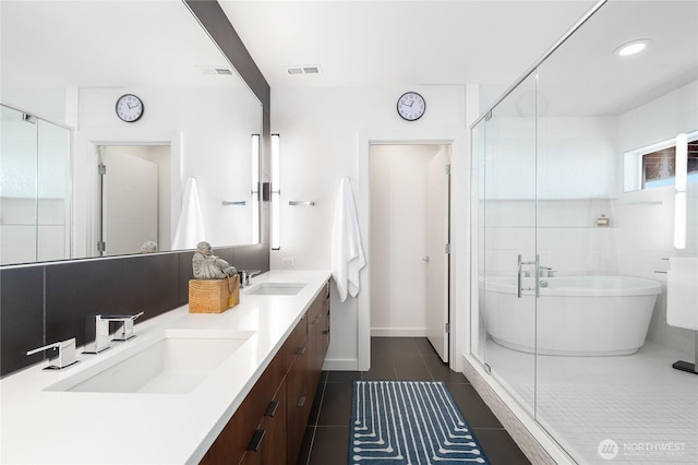 7734 Seward Park Ave S, Seattle, WA 98118 - bathroom featuring a freestanding tub, a shower stall, double vanity, and tile patterned flooring