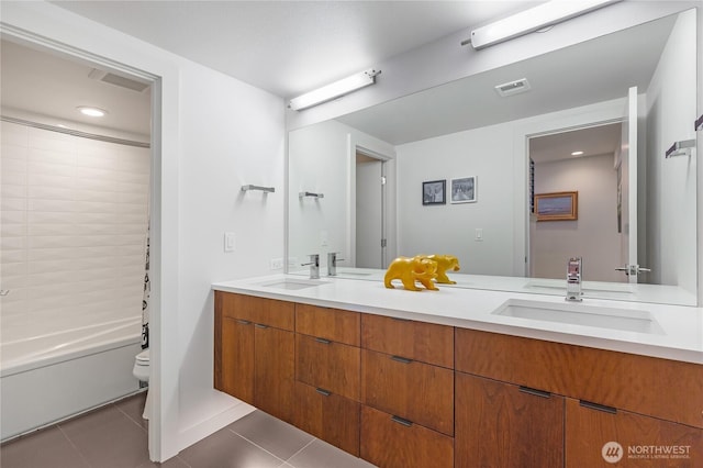 7734 Seward Park Ave S, Seattle, WA 98118 - bathroom with toilet, tile patterned flooring, double vanity, shower / bath combination, and recessed lighting