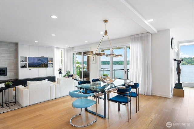 7734 Seward Park Ave S, Seattle, WA 98118 - dining area with light wood finished floors, recessed lighting, and a water view