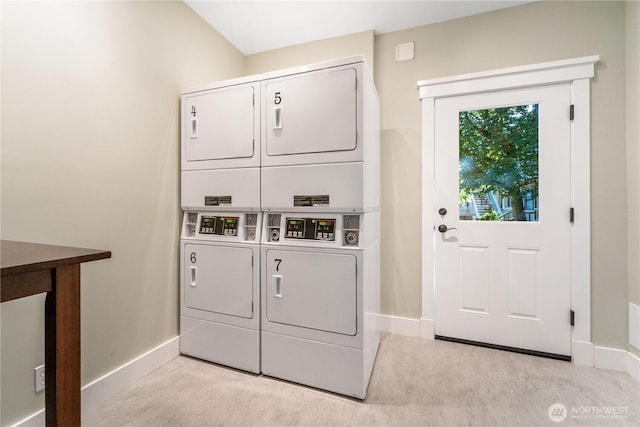 250 Tucker Ave Unit 25, Friday Harbor, WA 98250 - community laundry room featuring estacked washer and dryer, baseboards, carpet floors, and washing machine and dryer