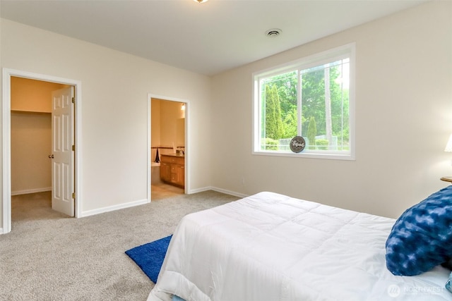 161 Malinka Ln, Chehalis, WA 98532 - bedroom with carpet flooring, baseboards, a walk in closet, and ensuite bathroom