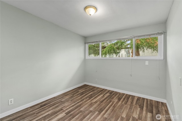 2404 Sumner Ave, Aberdeen, WA 98520 - empty room with baseboards and dark wood-style floors