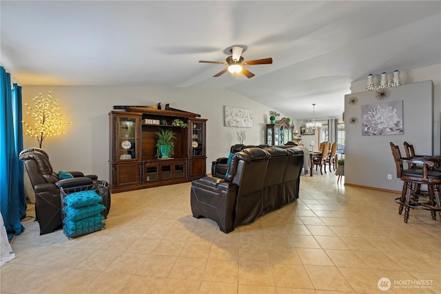 985 S 10th Ave, Othello, WA 99344 - living room with a chandelier, a ceiling fan, vaulted ceiling, and light tile patterned floors