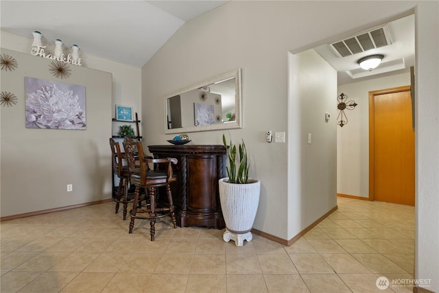 985 S 10th Ave, Othello, WA 99344 - indoor dry bar featuring vaulted ceiling, light tile patterned floors, and baseboards
