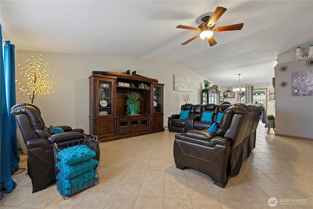 985 S 10th Ave, Othello, WA 99344 - living room featuring vaulted ceiling, a chandelier, a ceiling fan, and light tile patterned floors