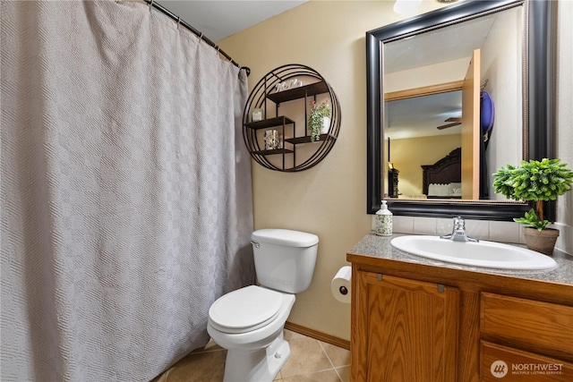 985 S 10th Ave, Othello, WA 99344 - full bath with tile patterned flooring, toilet, vanity, and baseboards
