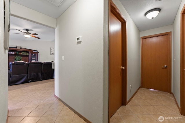 985 S 10th Ave, Othello, WA 99344 - hallway with light tile patterned floors and baseboards