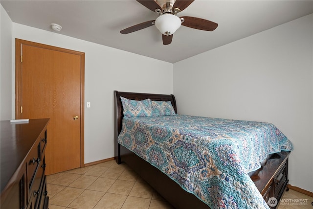 985 S 10th Ave, Othello, WA 99344 - bedroom featuring light tile patterned floors, baseboards, and a ceiling fan