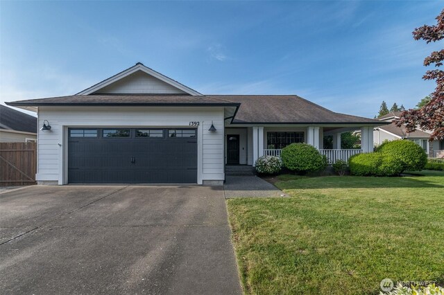 1392 Myers Dr, Ferndale, WA 98248 - ranch-style home featuring an attached garage, driveway, roof with shingles, and a porch