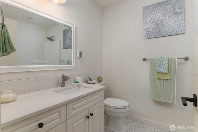 1392 Myers Dr, Ferndale, WA 98248 - full bath with toilet, vanity, tile patterned floors, a shower, and baseboards