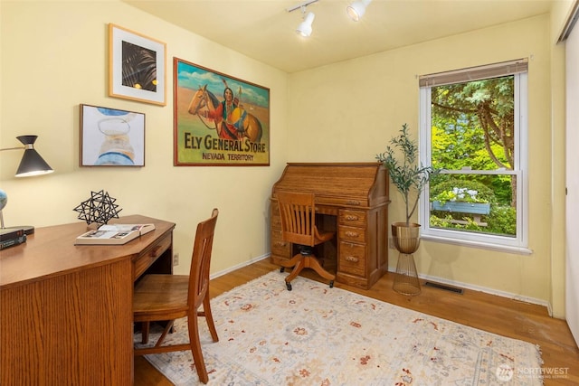 7915 SE 34th St, Mercer Island, WA 98040 - office with wood finished floors, baseboards, and rail lighting