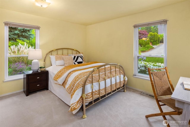 7915 SE 34th St, Mercer Island, WA 98040 - carpeted bedroom featuring multiple windows and baseboards