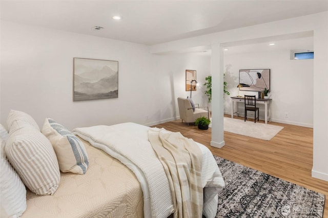 7915 SE 34th St, Mercer Island, WA 98040 - bedroom with wood finished floors, baseboards, and recessed lighting