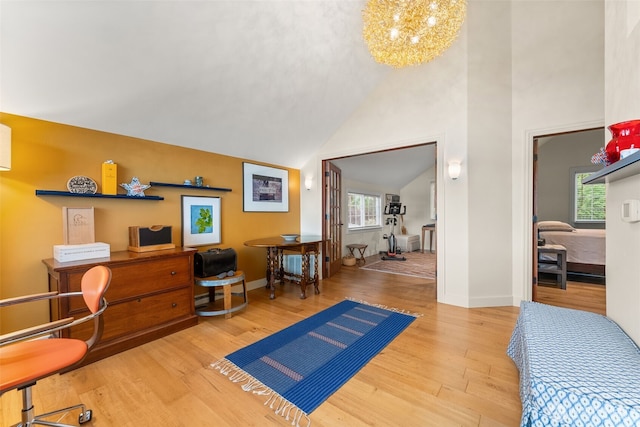 7342 Huckleberry Rd NW, Olympia, WA 98502 - home office featuring a chandelier, wood finished floors, baseboards, and high vaulted ceiling