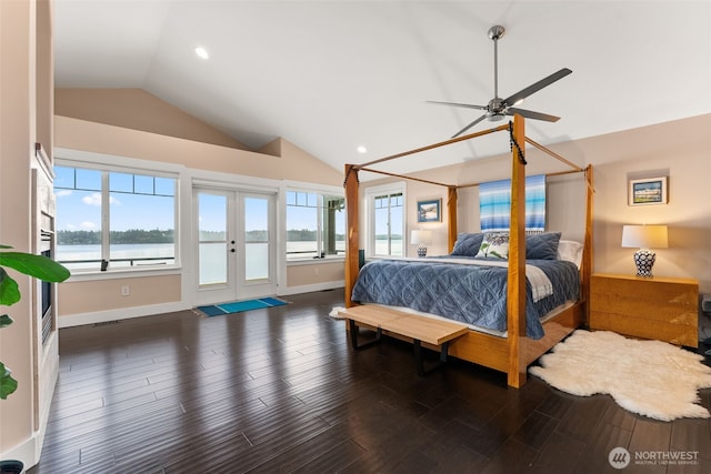 7342 Huckleberry Rd NW, Olympia, WA 98502 - bedroom with vaulted ceiling, access to exterior, french doors, wood finished floors, and multiple windows