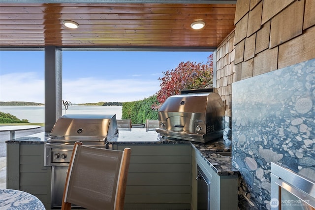 7342 Huckleberry Rd NW, Olympia, WA 98502 - view of patio / terrace with a water view