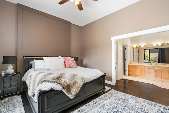 381 Pebble Beach Dr, Cle Elum, WA 98922 - bedroom with wood finished floors, ensuite bath, baseboards, and a ceiling fan