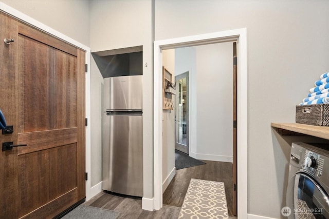 381 Pebble Beach Dr, Cle Elum, WA 98922 - laundry area featuring washer / clothes dryer, dark wood-style flooring, and baseboards