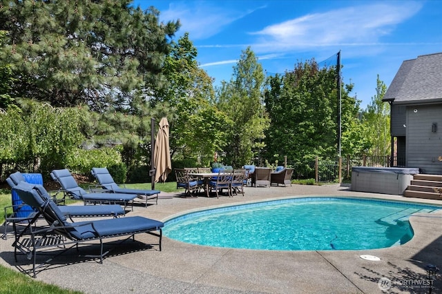 381 Pebble Beach Dr, Cle Elum, WA 98922 - swimming pool featuring a hot tub, a patio area, view of wooded area, and outdoor dining area