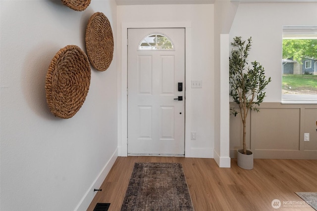 2707 Angel Ln, East Wenatchee, WA 98802 - foyer entrance featuring wood finished floors, plenty of natural light, and baseboards