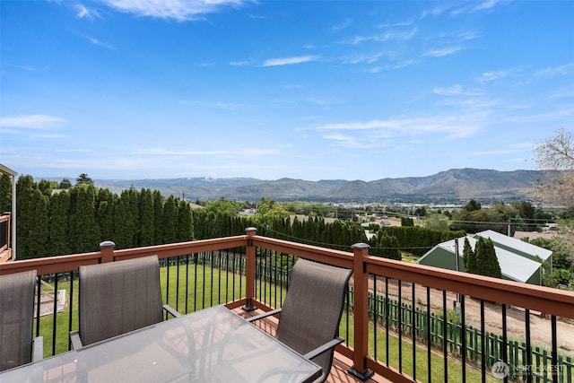 2707 Angel Ln, East Wenatchee, WA 98802 - deck featuring a mountain view, outdoor dining space, and a lawn