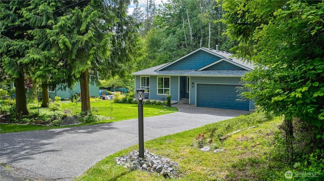 157 Northwood Dr, Point Roberts, WA 98281 - single story home featuring asphalt driveway, an attached garage, and a front yard