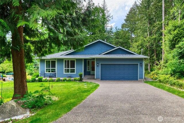 157 Northwood Dr, Point Roberts, WA 98281 - single story home featuring asphalt driveway, a garage, a front lawn, and a shingled roof