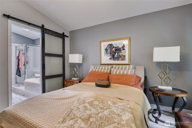 157 Northwood Dr, Point Roberts, WA 98281 - bedroom with a barn door, lofted ceiling, a spacious closet, a closet, and baseboards
