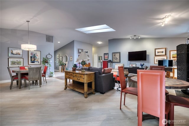 157 Northwood Dr, Point Roberts, WA 98281 - living area featuring light wood-style flooring, a skylight, vaulted ceiling, recessed lighting, and baseboards