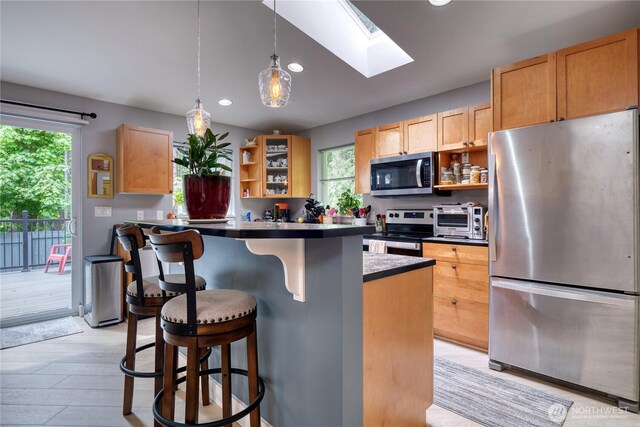 157 Northwood Dr, Point Roberts, WA 98281 - kitchen featuring appliances with stainless steel finishes, open shelves, plenty of natural light, a breakfast bar, and recessed lighting