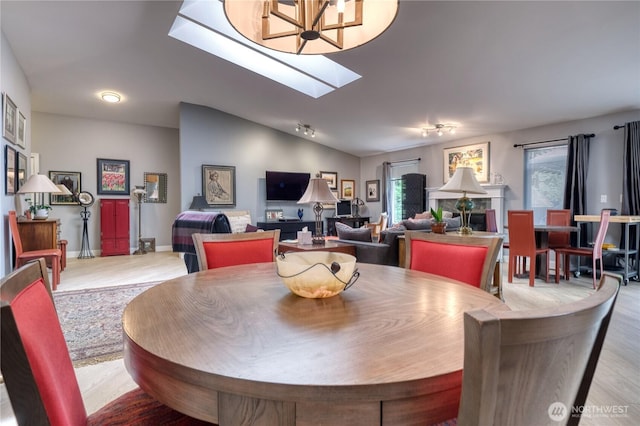 157 Northwood Dr, Point Roberts, WA 98281 - dining room featuring light wood-style flooring, a chandelier, and vaulted ceiling