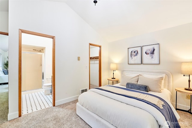 9514 Sand Point Way NE, Seattle, WA 98115 - carpeted bedroom with vaulted ceiling, baseboards, ensuite bathroom, a walk in closet, and a closet