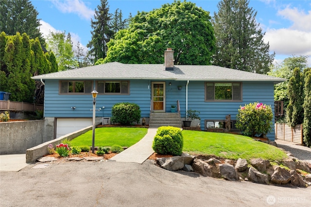 229 S 171st St, Burien, WA 98148 - view of front facade with a chimney, a front yard, a garage, and asphalt driveway