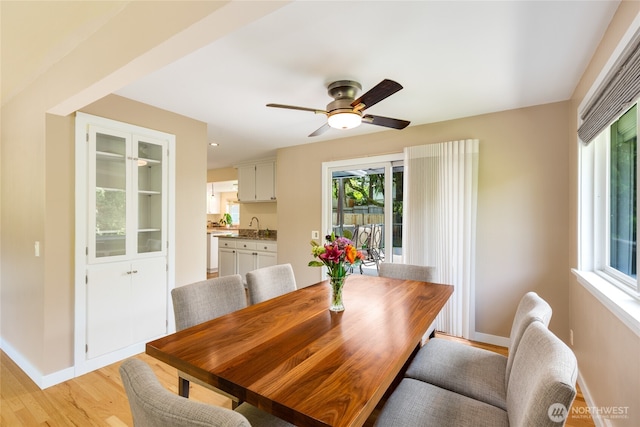229 S 171st St, Burien, WA 98148 - dining space with light wood-type flooring, baseboards, and ceiling fan