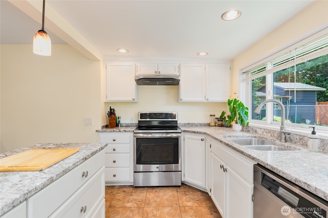 229 S 171st St, Burien, WA 98148 - kitchen with stainless steel appliances, a sink, white cabinets, under cabinet range hood, and recessed lighting