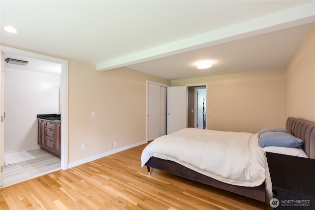 229 S 171st St, Burien, WA 98148 - bedroom with light wood finished floors, baseboards, and ensuite bathroom