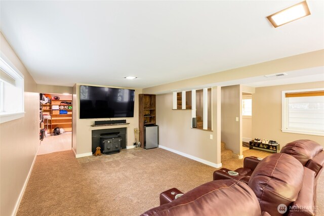 229 S 171st St, Burien, WA 98148 - carpeted living room featuring baseboards, stairway, and a wood stove