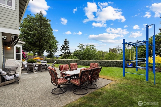 2601 59th St SW, Everett, WA 98203 - view of patio with a playground, outdoor dining space, and area for grilling