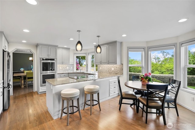 2601 59th St SW, Everett, WA 98203 - kitchen with stainless steel appliances, gray cabinets, plenty of natural light, and recessed lighting