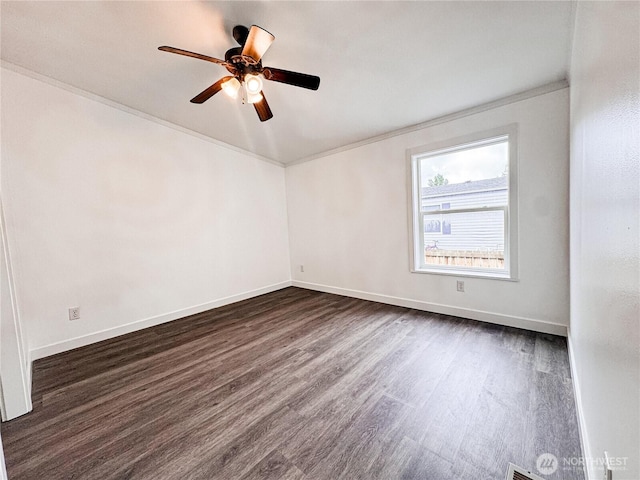700 N Reed St Unit 72, Sedro Woolley, WA 98284 - empty room featuring dark wood-style flooring, ceiling fan, baseboards, and ornamental molding
