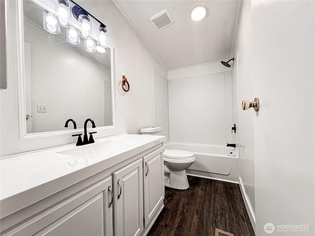 700 N Reed St Unit 72, Sedro Woolley, WA 98284 - full bathroom featuring toilet, wood finished floors, vanity, and  shower combination