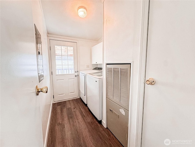 700 N Reed St Unit 72, Sedro Woolley, WA 98284 - washroom featuring cabinet space, washer and clothes dryer, dark wood-style floors, a heating unit, and baseboards