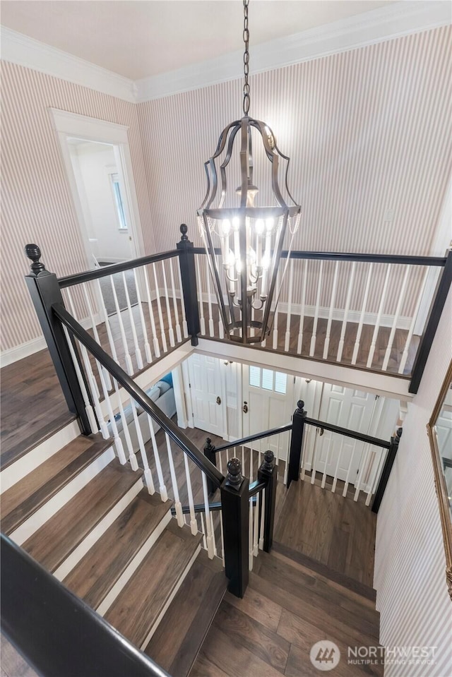 4217 Lakeridge Dr E, Lake Tapps, WA 98391 - stairway featuring a chandelier, wood finished floors, and ornamental molding
