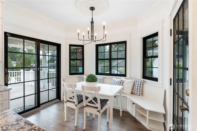 4217 Lakeridge Dr E, Lake Tapps, WA 98391 - dining space with a chandelier, dark wood-style flooring, and crown molding