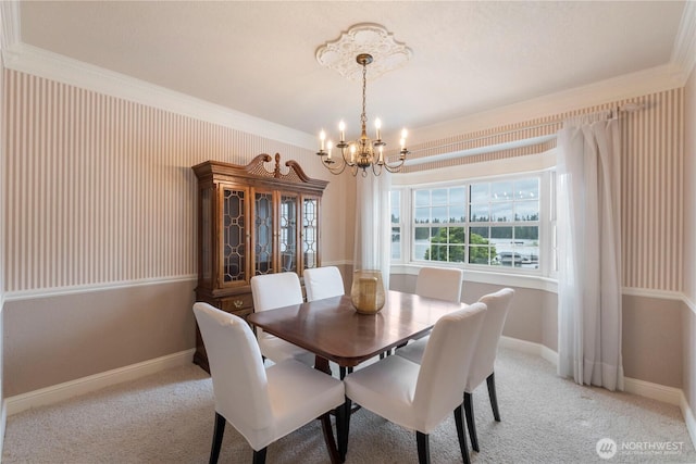 4217 Lakeridge Dr E, Lake Tapps, WA 98391 - dining area with a chandelier, crown molding, baseboards, and light colored carpet